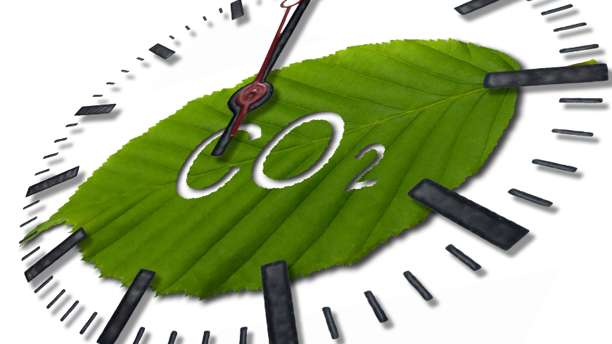 Aiguille de l'horloge se déplaçant autour d'une feuille verte avec le mot CO₂